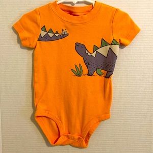 Carters Orange with dinosaurs onesie. SZ 18M. Excellent condition.